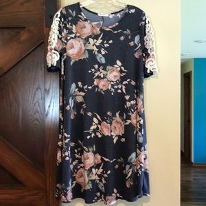Navy with floral. Has lace sleeves
